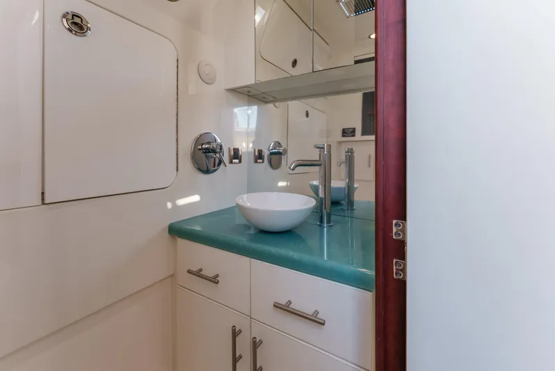 Steam N Demon Yacht Photos Pics Luxurious bathroom interior of 2019 Buddy Davis 42 CC boat with modern fixtures.