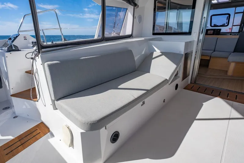 Nostos Yacht Photos Pics Modern Nautitech 40 Open 2020 yacht interior with comfortable seating and ocean view.