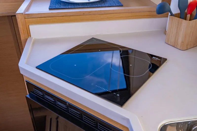 Nostos Yacht Photos Pics Modern kitchen area in 2020 Nautitech 40 Open catamaran with sleek induction cooktop.