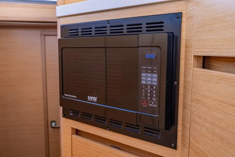 Nostos Yacht Photos Pics Built-in microwave in 2020 Nautitech 40 Open yacht kitchen.