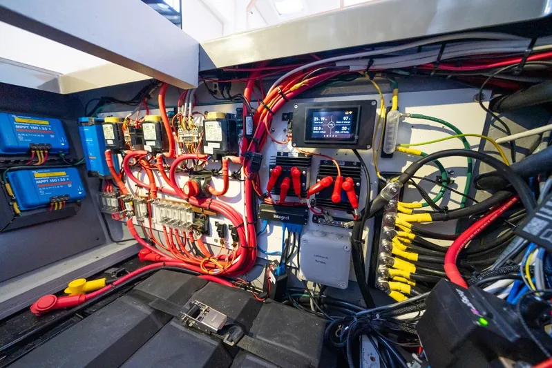 Nostos Yacht Photos Pics Electrical system of a 2020 Nautitech 40 Open catamaran, featuring wiring and control panels.