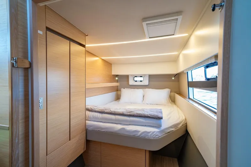 Nostos Yacht Photos Pics Luxurious cabin interior of 2020 Nautitech 40 Open catamaran with cozy bed and modern design.