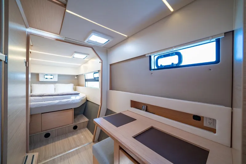Nostos Yacht Photos Pics Interior of 2020 Nautitech 40 Open catamaran, featuring a cozy bedroom and modern design.
