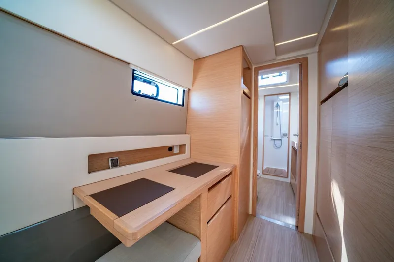 Nostos Yacht Photos Pics Modern interior of 2020 Nautitech 40 Open catamaran, featuring sleek wood finishes and compact design.