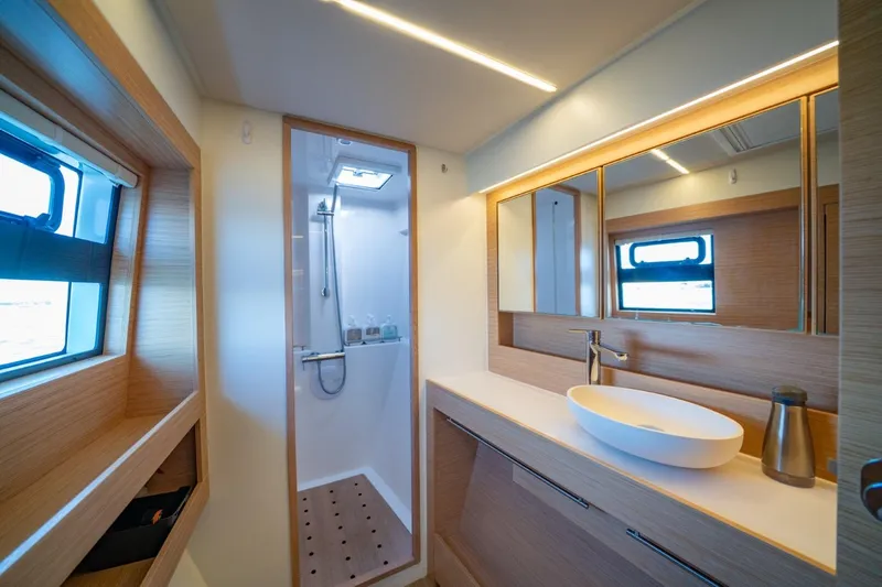 Nostos Yacht Photos Pics Modern bathroom interior of 2020 Nautitech 40 Open yacht, featuring sleek design and ample lighting.
