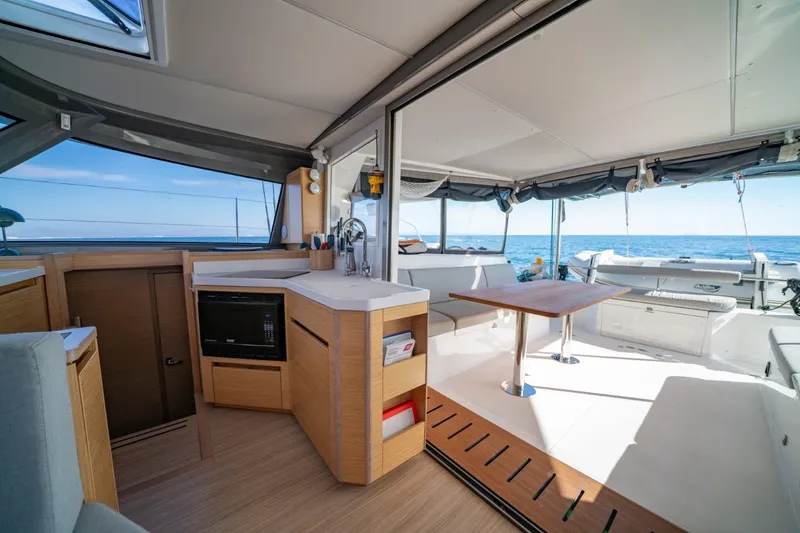 Nostos Yacht Photos Pics Interior of 2020 Nautitech 40 Open catamaran with modern kitchen and ocean view.