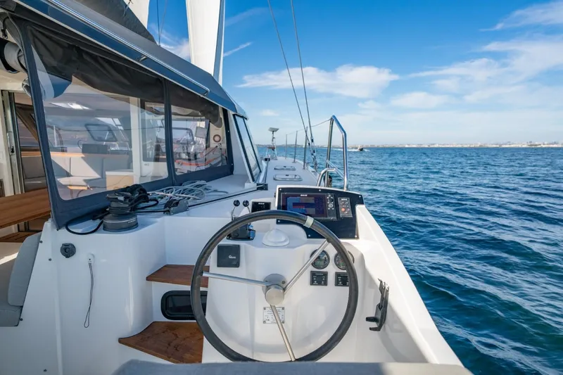 Nostos Yacht Photos Pics 2020 Nautitech 40 Open catamaran helm with ocean view, featuring modern navigation equipment.