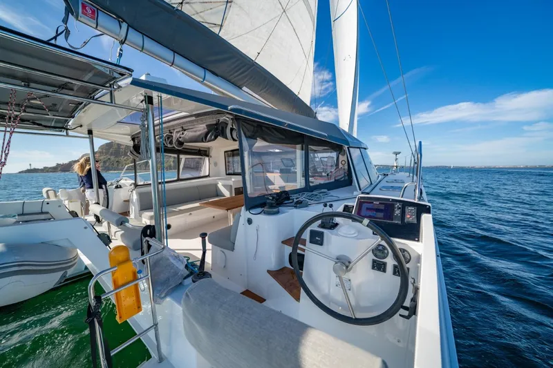 Nostos Yacht Photos Pics 2020 Nautitech 40 Open catamaran sailing on open water, featuring modern cockpit and helm.