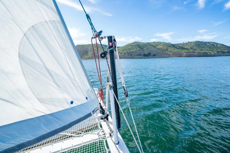 Nostos Yacht Photos Pics Sailing on a 2020 Nautitech 40 Open catamaran with scenic coastal views.