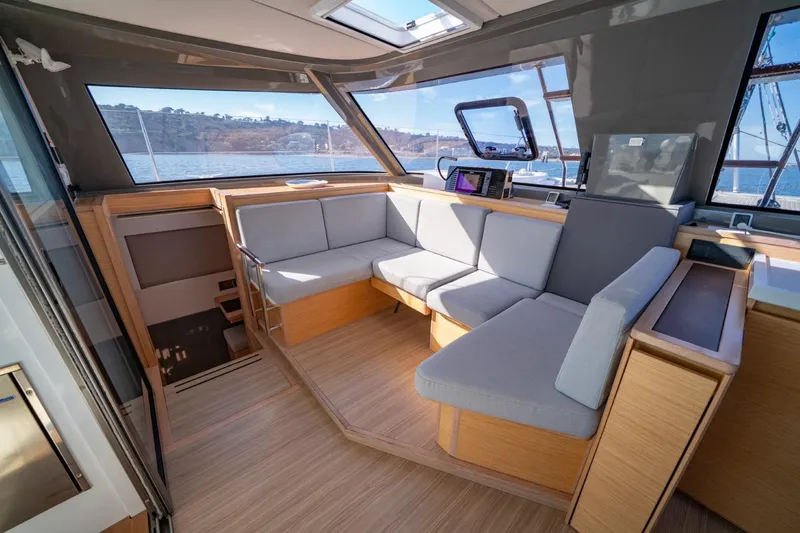 Nostos Yacht Photos Pics Luxurious interior of 2020 Nautitech 40 Open catamaran with modern seating and panoramic windows.