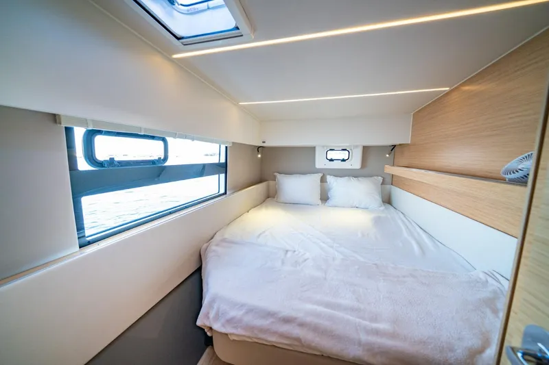 Nostos Yacht Photos Pics Cozy bedroom interior of 2020 Nautitech 40 Open catamaran with modern design and natural light.