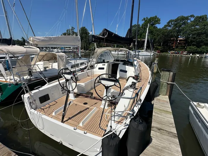  Yacht Photos Pics 2024 J Boats J/40 sailboat docked, featuring a sleek deck and dual steering wheels.