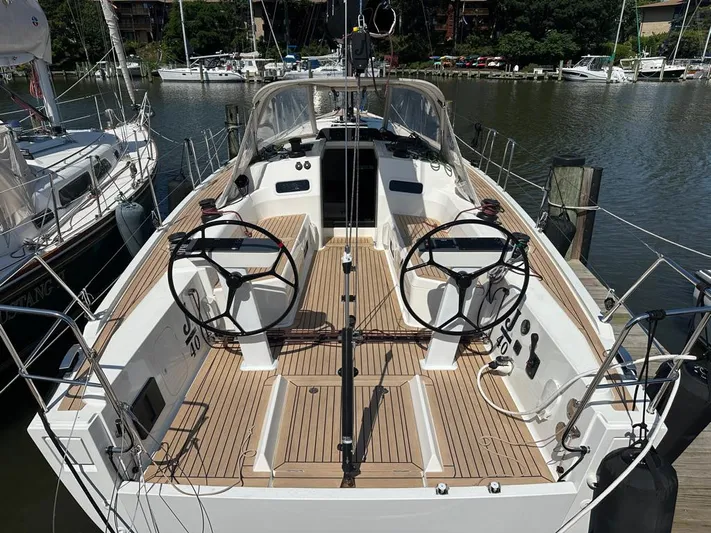  Yacht Photos Pics 2024 J Boats J/40 sailboat with dual steering wheels docked at a marina.
