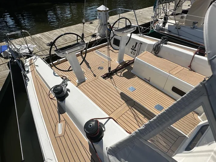  Yacht Photos Pics 2024 J Boats J/40 sailboat with dual steering wheels and teak deck at dock.