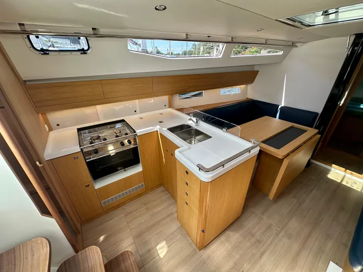  Yacht Photos Pics Modern interior of 2024 J Boats J/40 yacht with sleek kitchen and dining area.