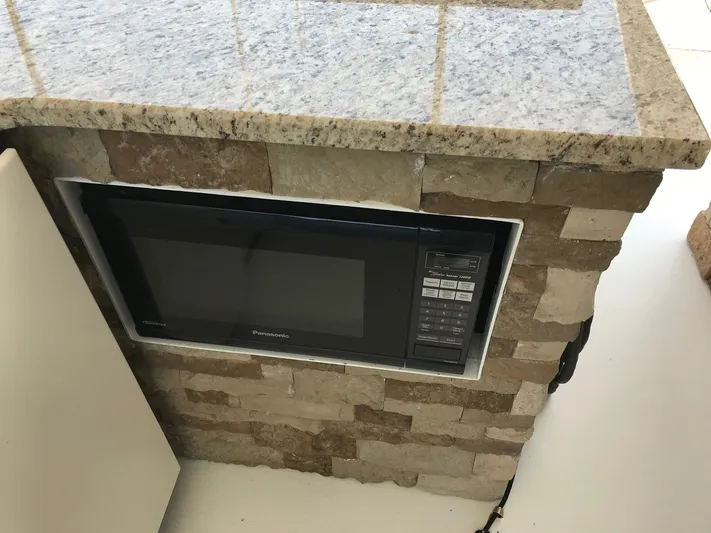 St. Somewhere Yacht Photos Pics Built-in microwave in stone counter on 2017 Sumerset houseboat.