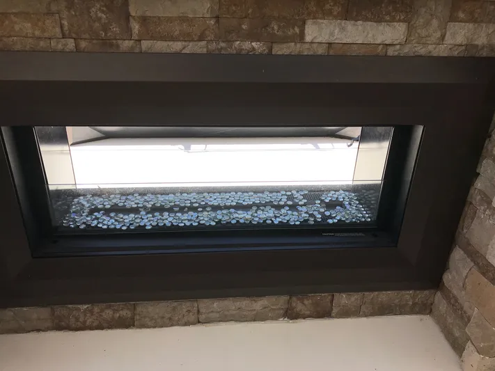 St. Somewhere Yacht Photos Pics Modern fireplace with glass stones on a Sumerset 2017 houseboat.