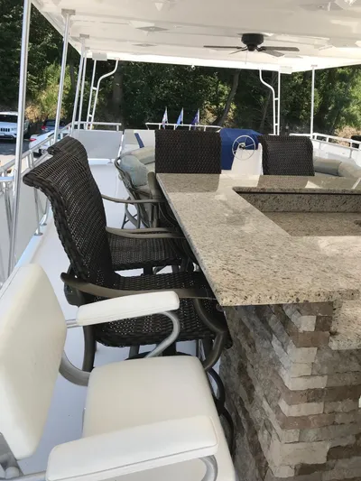 St. Somewhere Yacht Photos Pics Luxurious 2017 Sumerset houseboat with outdoor seating and granite bar area.