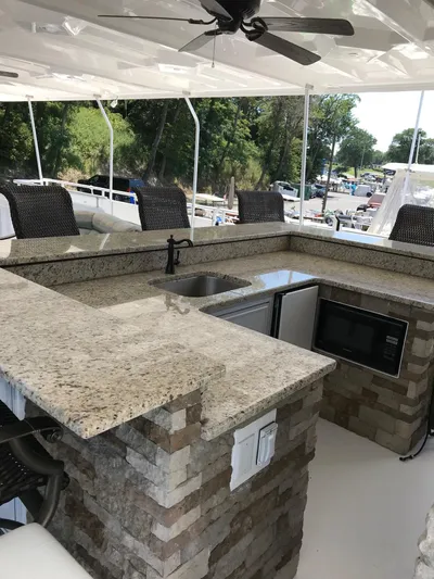 St. Somewhere Yacht Photos Pics Luxurious 2017 Sumerset houseboat kitchen with granite countertops and modern appliances.