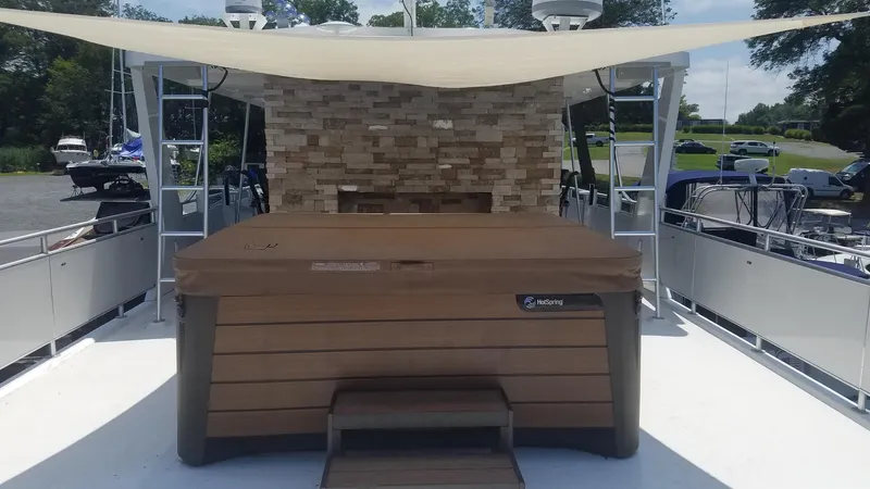 St. Somewhere Yacht Photos Pics 2017 Sumerset houseboat with hot tub and sunshade on deck.