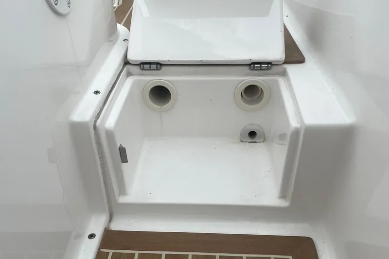 My Buddy Yacht Photos Pics 2016 Buddy Davis 28 Center Console boat compartment with drainage holes and white finish.