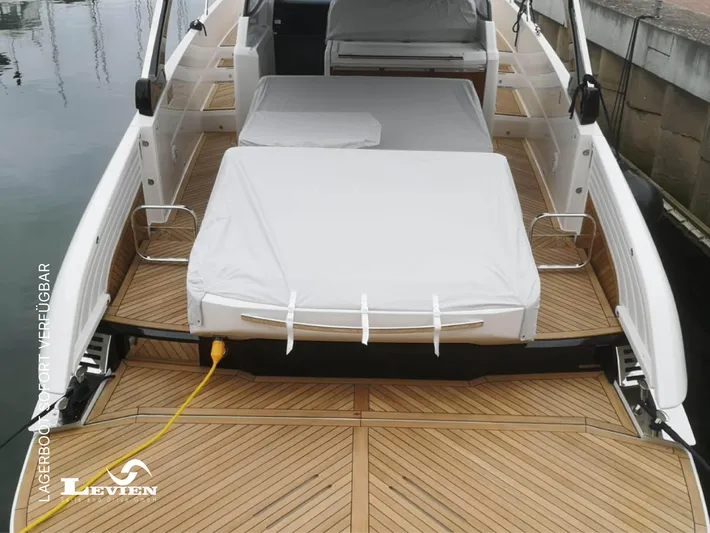  Yacht Photos Pics Luxury FIM 440 Regina yacht deck with cushioned seating, 2025 model, docked at marina.