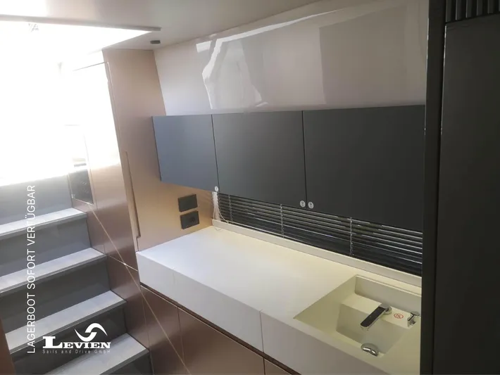  Yacht Photos Pics Modern kitchen interior on 2025 FIM 440 Regina yacht, featuring sleek cabinetry and minimalist design.