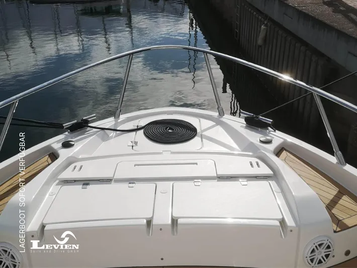  Yacht Photos Pics 2025 FIM 440 Regina boat deck with railing, docked at marina.