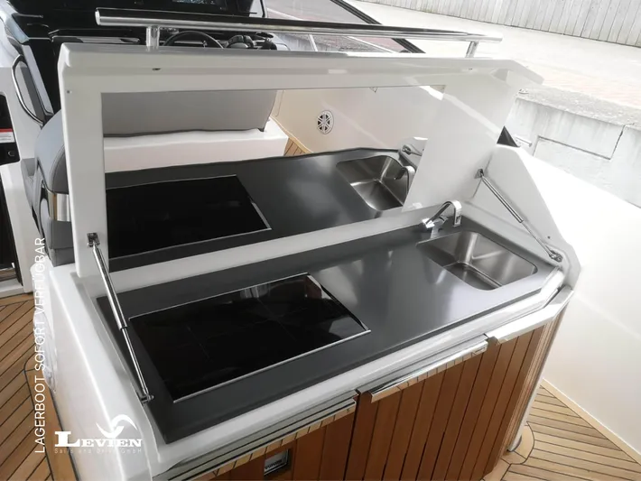  Yacht Photos Pics Outdoor kitchen on 2025 FIM 440 Regina yacht with dual sinks and cooktops.