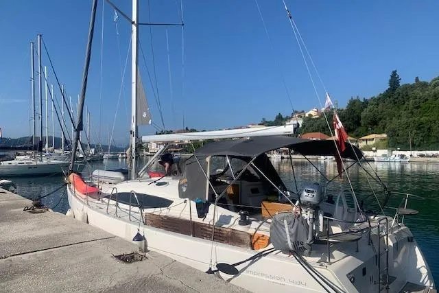 Aventura Yacht Photos Pics 2008 Elan Impression yacht docked at a marina with clear blue skies.