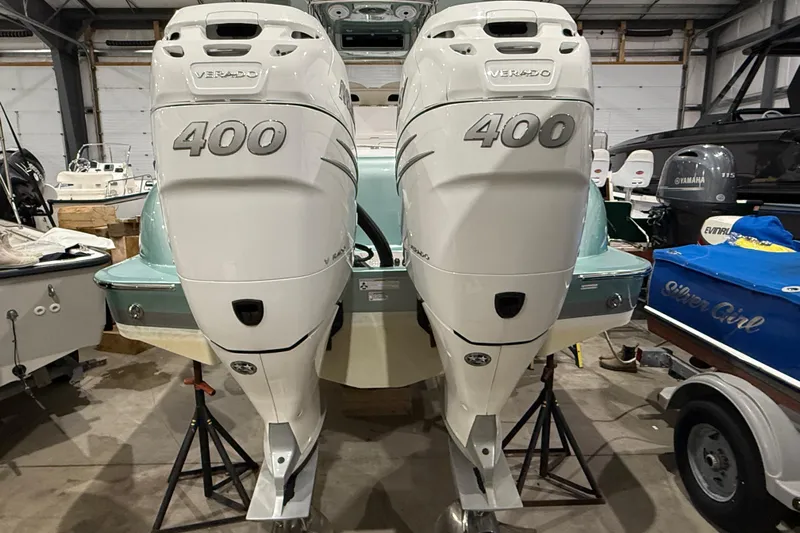  Yacht Photos Pics 2021 Mag Bay 33 CC with twin 400 Verado engines in a boat storage facility.