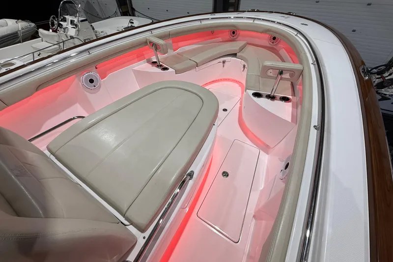  Yacht Photos Pics 2021 Mag Bay 33 CC boat interior with red ambient lighting and luxurious seating.