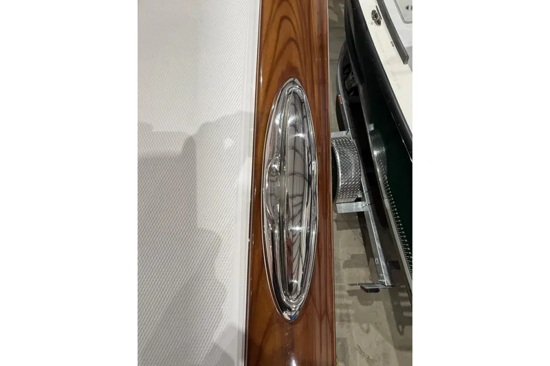  Yacht Photos Pics 2021 Mag Bay 33 CC boat detail with polished metal and wood finish.