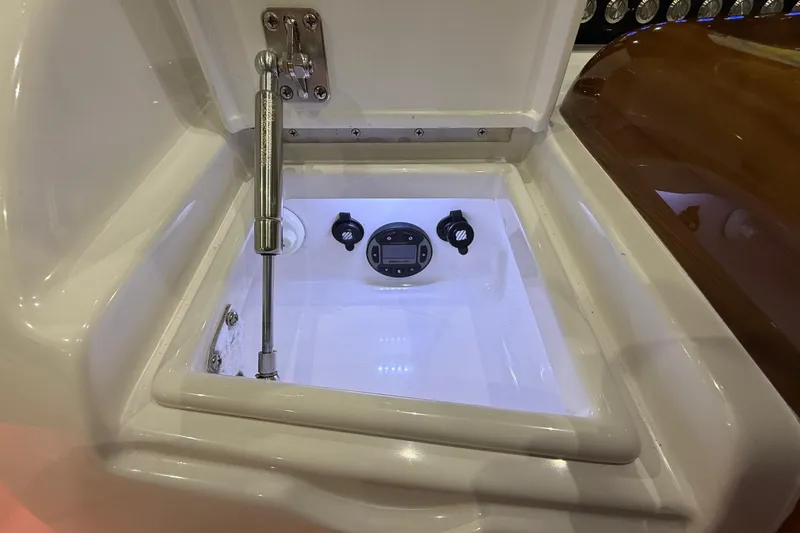  Yacht Photos Pics Control panel inside a 2021 Mag Bay 33 CC boat compartment, featuring a hydraulic strut.
