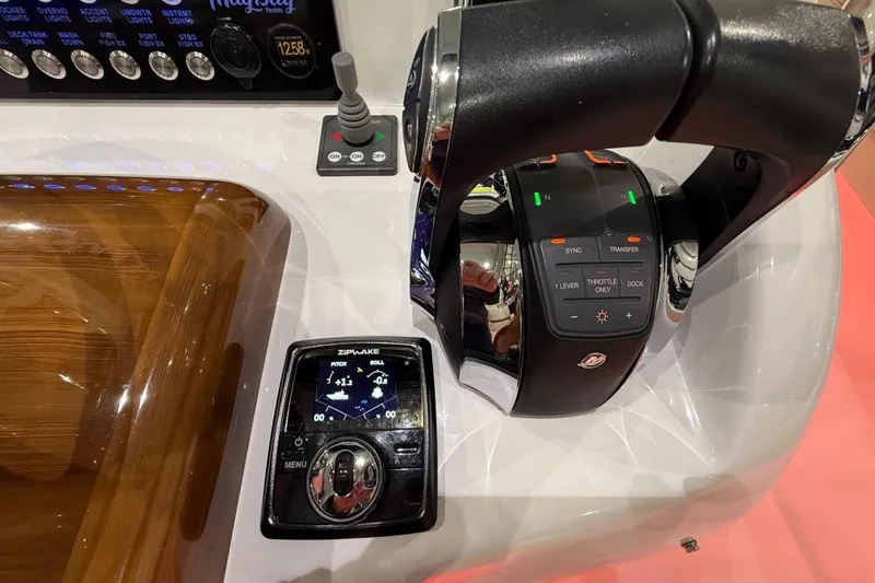  Yacht Photos Pics Control panel of 2021 Mag Bay 33 CC boat with throttle and display.