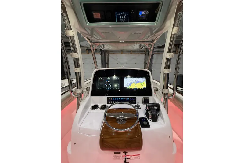  Yacht Photos Pics 2021 Mag Bay 33 CC boat helm with advanced navigation displays and controls.