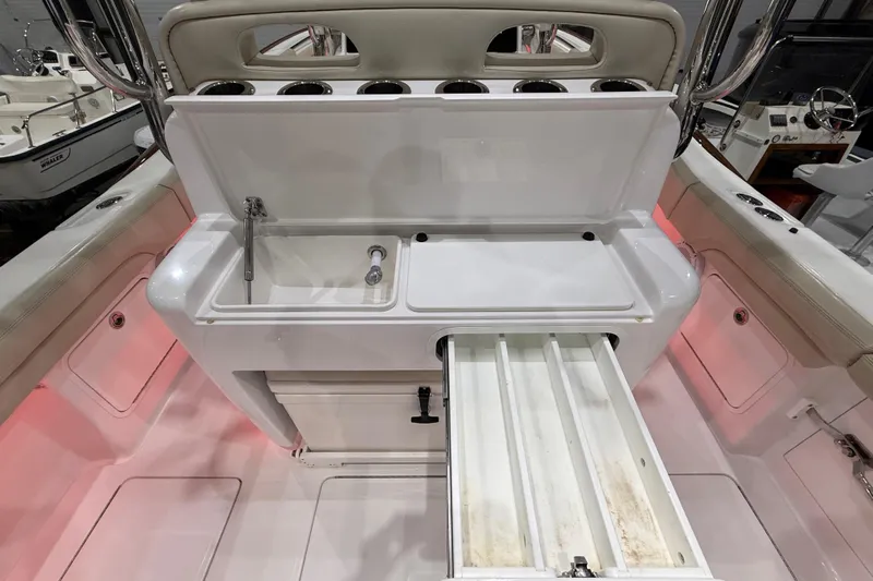  Yacht Photos Pics 2021 Mag Bay 33 CC boat interior with sink and storage compartments.