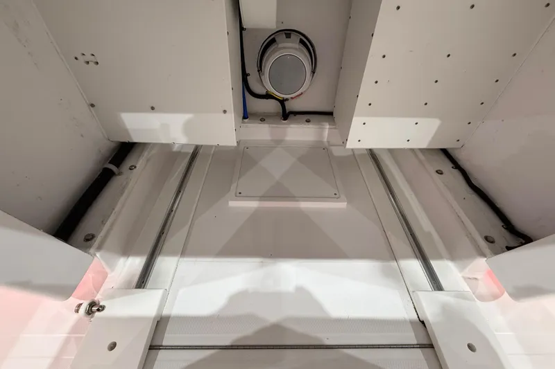  Yacht Photos Pics Interior view of 2021 Mag Bay 33 CC boat, showcasing storage compartment details.