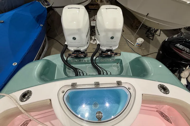  Yacht Photos Pics 2021 Mag Bay 33 CC boat with twin outboard engines and livewell.