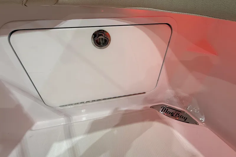  Yacht Photos Pics 2021 Mag Bay 33 CC boat interior storage compartment with logo detail.