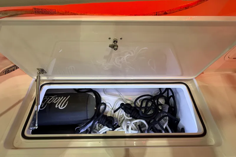 Yacht Photos Pics Open storage compartment on 2021 Mag Bay 33 CC boat with ropes and fender.