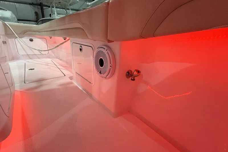  Yacht Photos Pics 2021 Mag Bay 33 CC boat interior with red LED lighting and storage compartments.