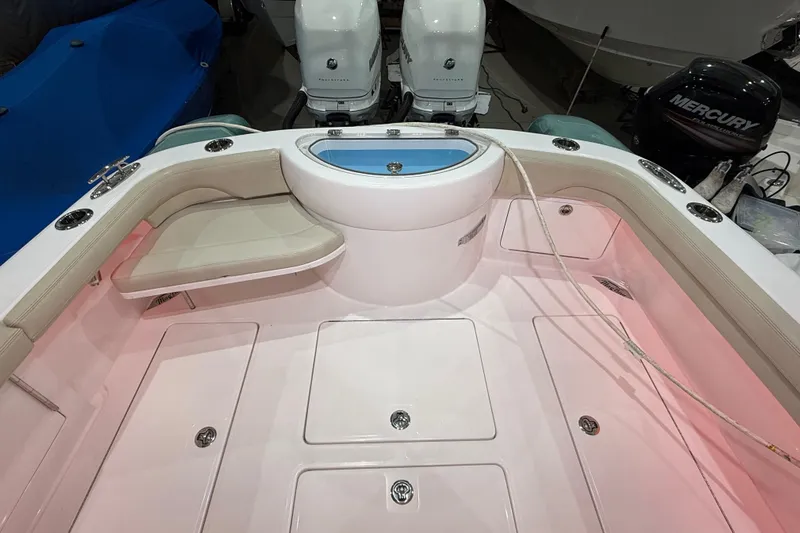  Yacht Photos Pics 2021 Mag Bay 33 CC boat deck with seating and storage compartments.