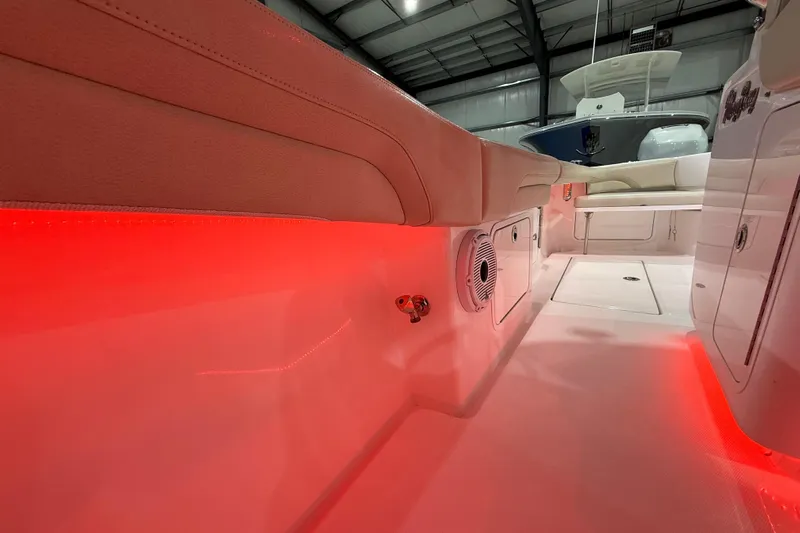  Yacht Photos Pics 2021 Mag Bay 33 CC boat interior with red LED lighting and cushioned seating.