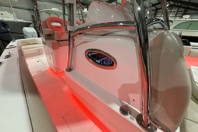  Yacht Photos Pics 2021 Mag Bay 33 CC boat interior with red LED lighting and sleek design.