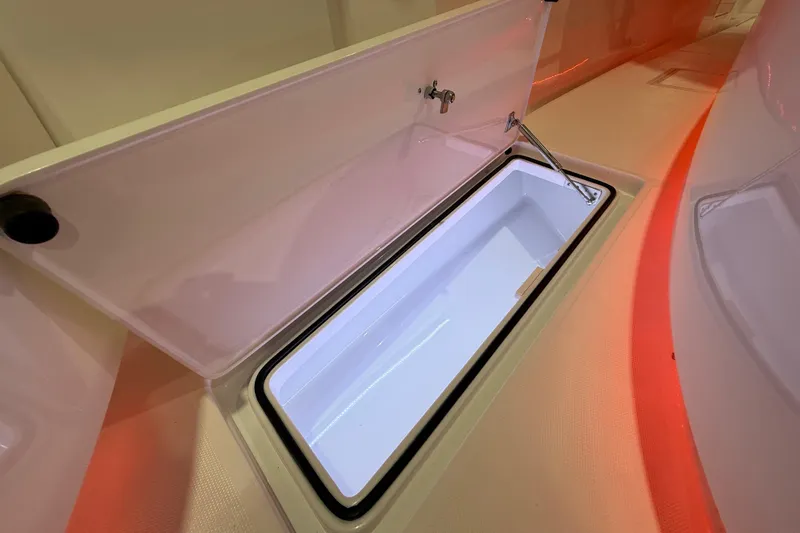  Yacht Photos Pics Open storage compartment on 2021 Mag Bay 33 CC boat, featuring sleek design and ample space.