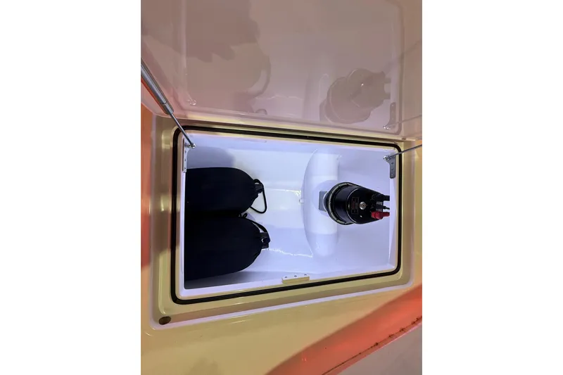  Yacht Photos Pics Open storage compartment in 2021 Mag Bay 33 CC boat, featuring equipment and accessories.