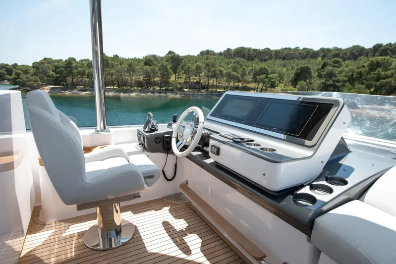 Prewi Yacht Photos Pics Luxurious helm of 2022 Azimut 78 FLY yacht with modern controls and scenic view.