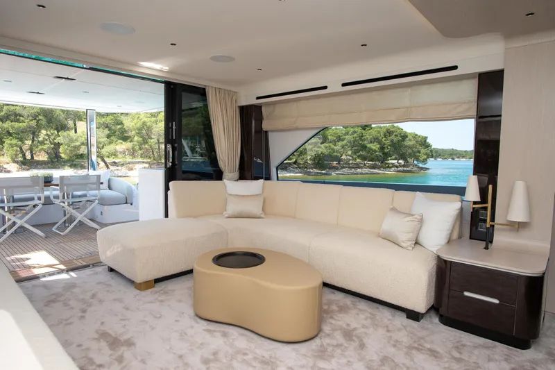 Prewi Yacht Photos Pics Luxurious interior of 2022 Azimut 78 FLY yacht with elegant seating and scenic ocean view.