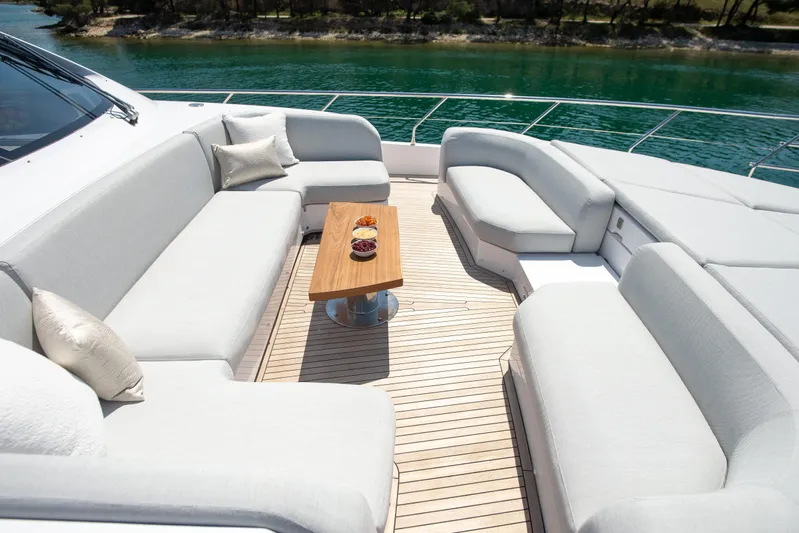 Prewi Yacht Photos Pics Luxurious seating area on 2022 Azimut 78 FLY yacht with elegant cushions and wooden table.